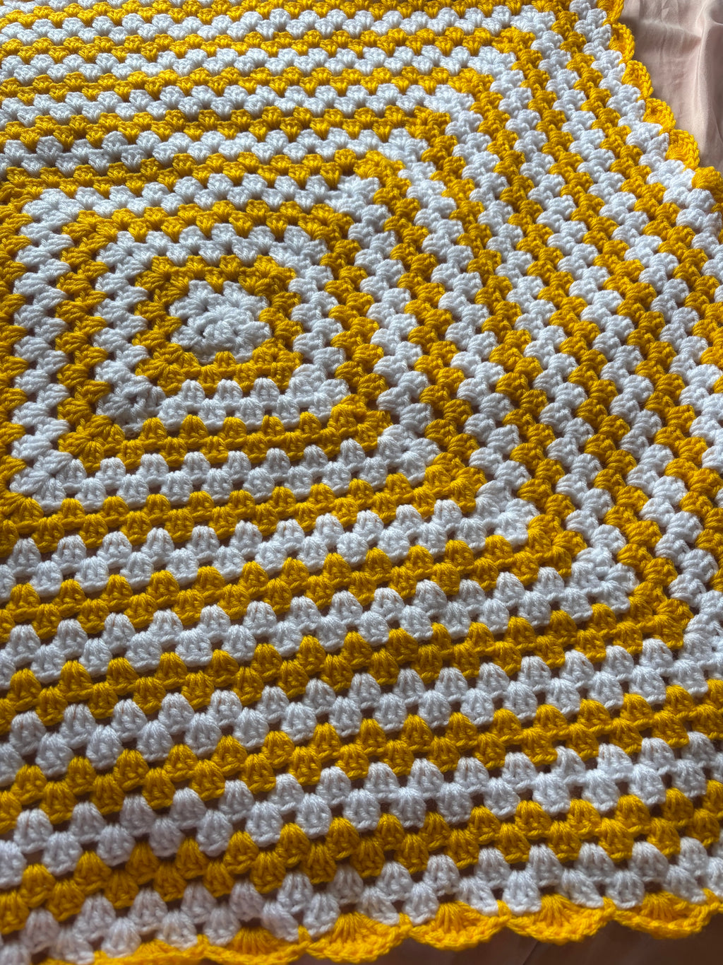 Yellow and white baby blanket