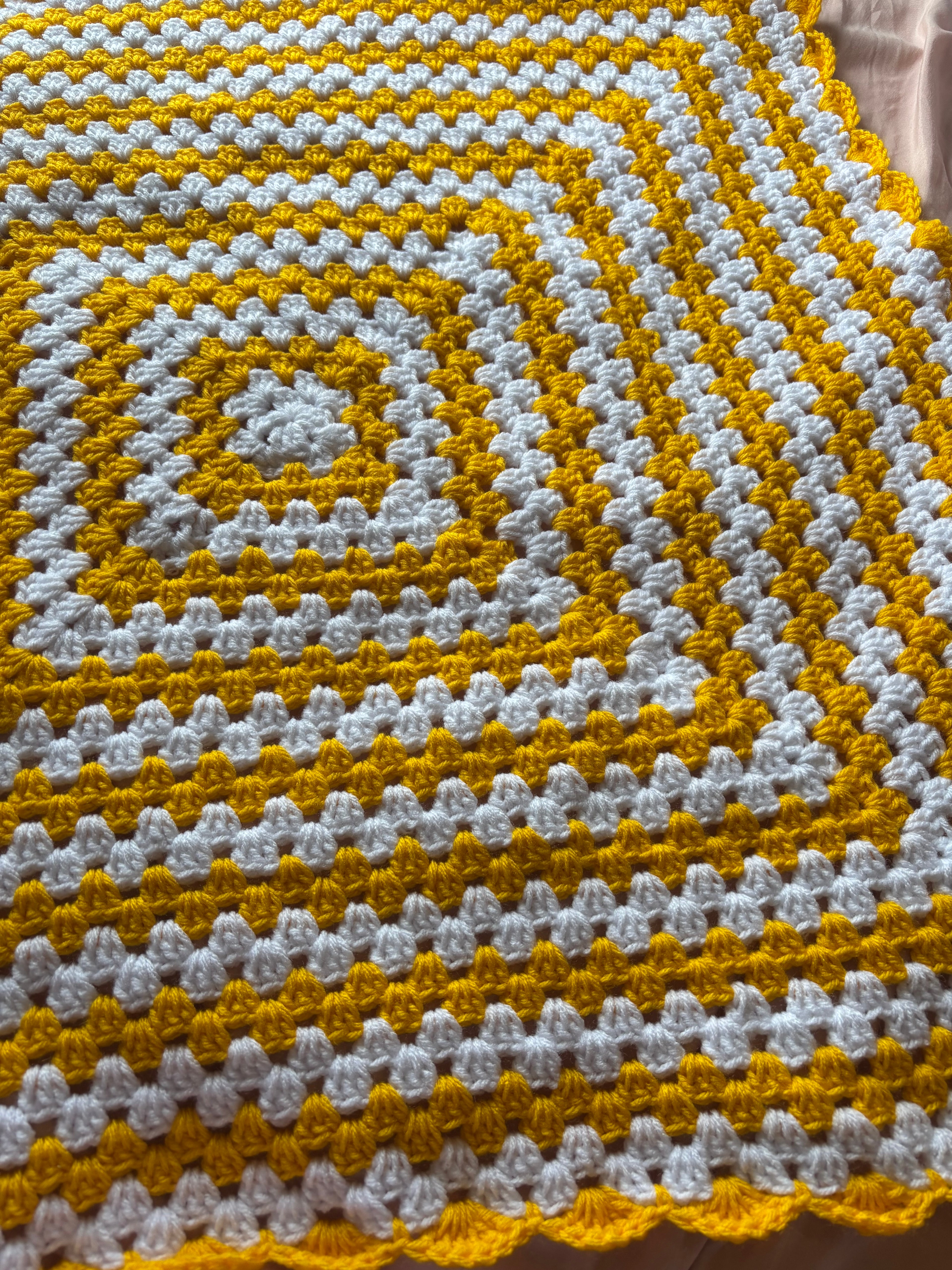 Yellow and white baby blanket