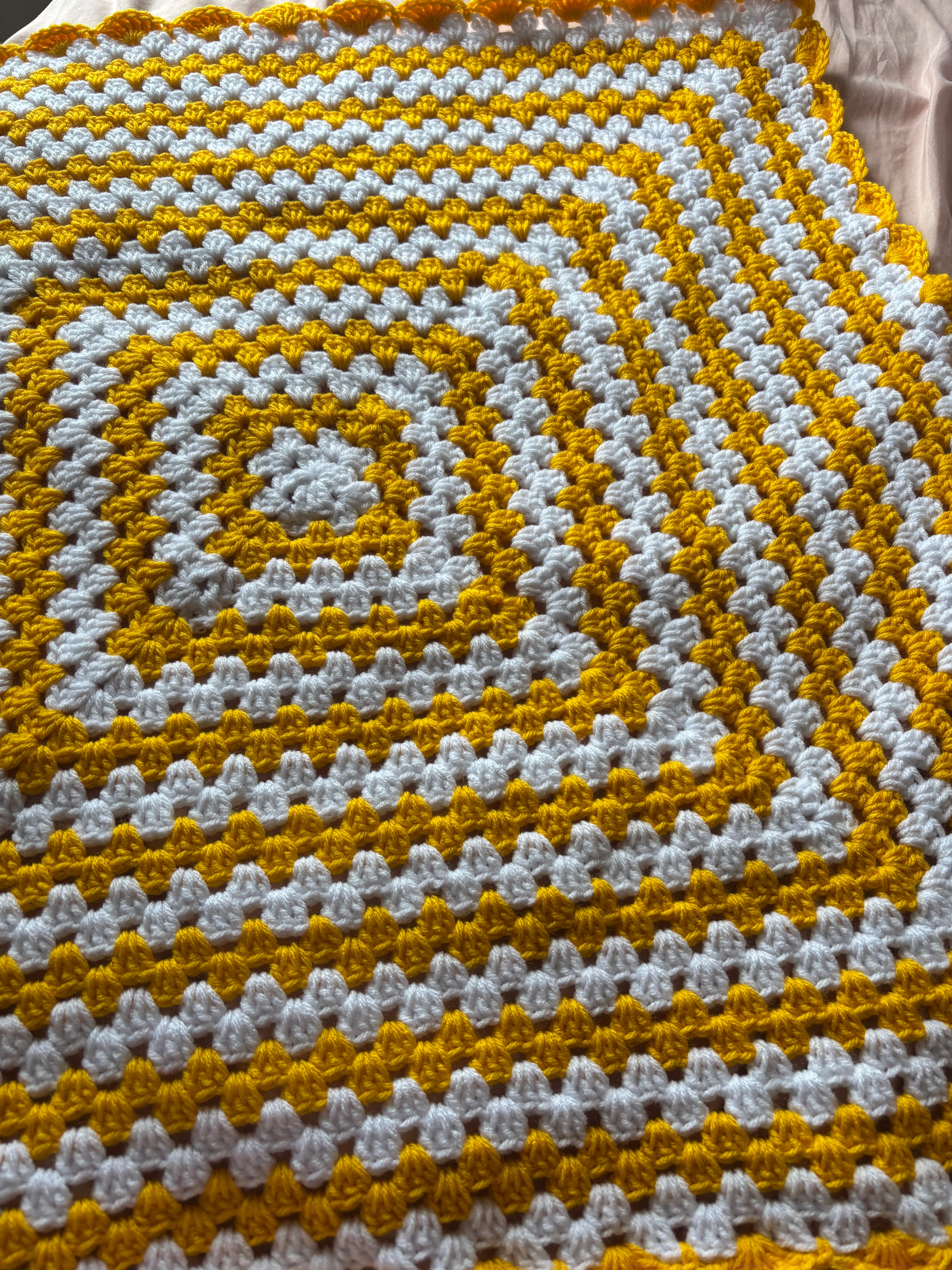 Yellow and white baby blanket