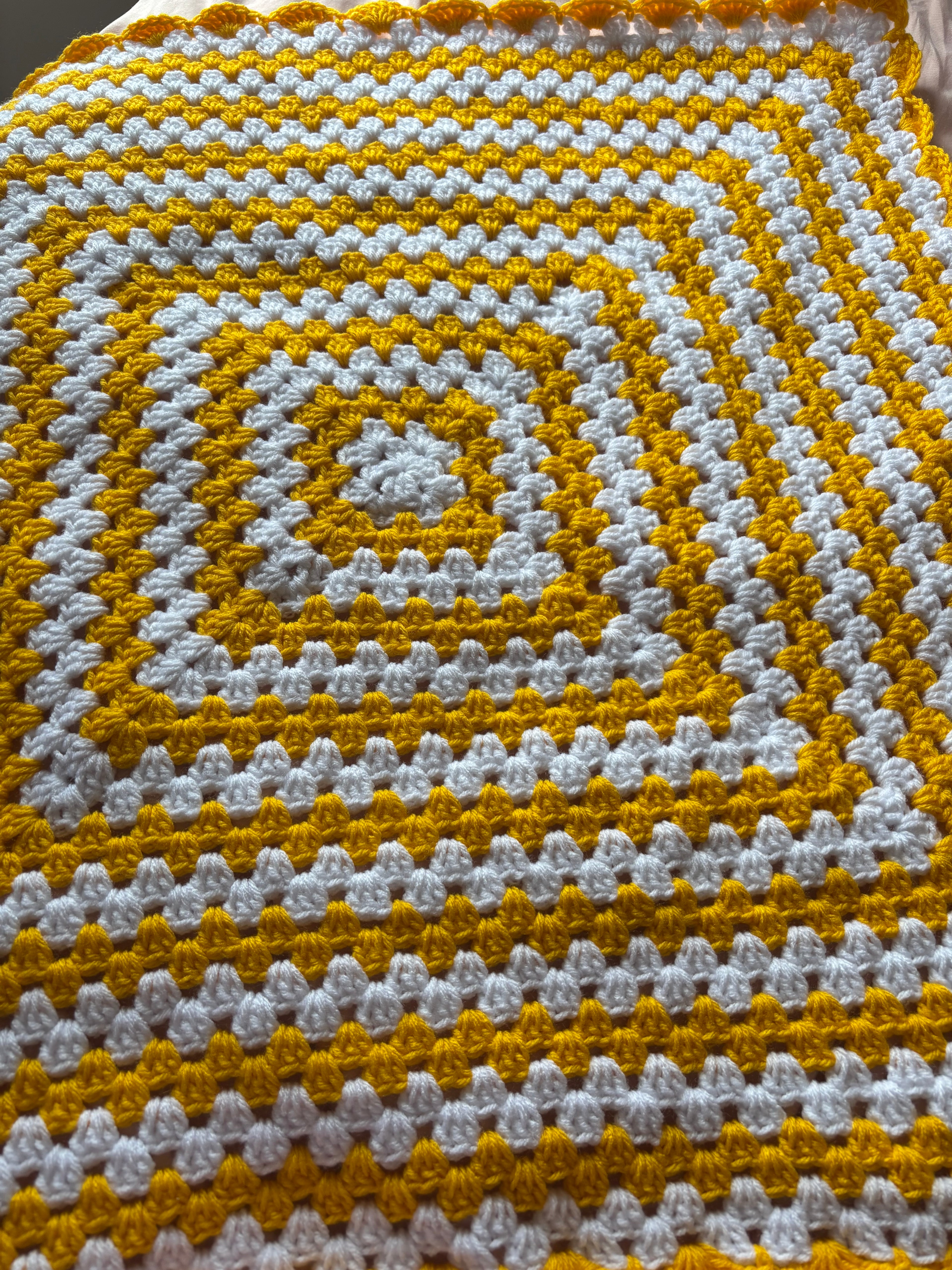 Yellow and white baby blanket